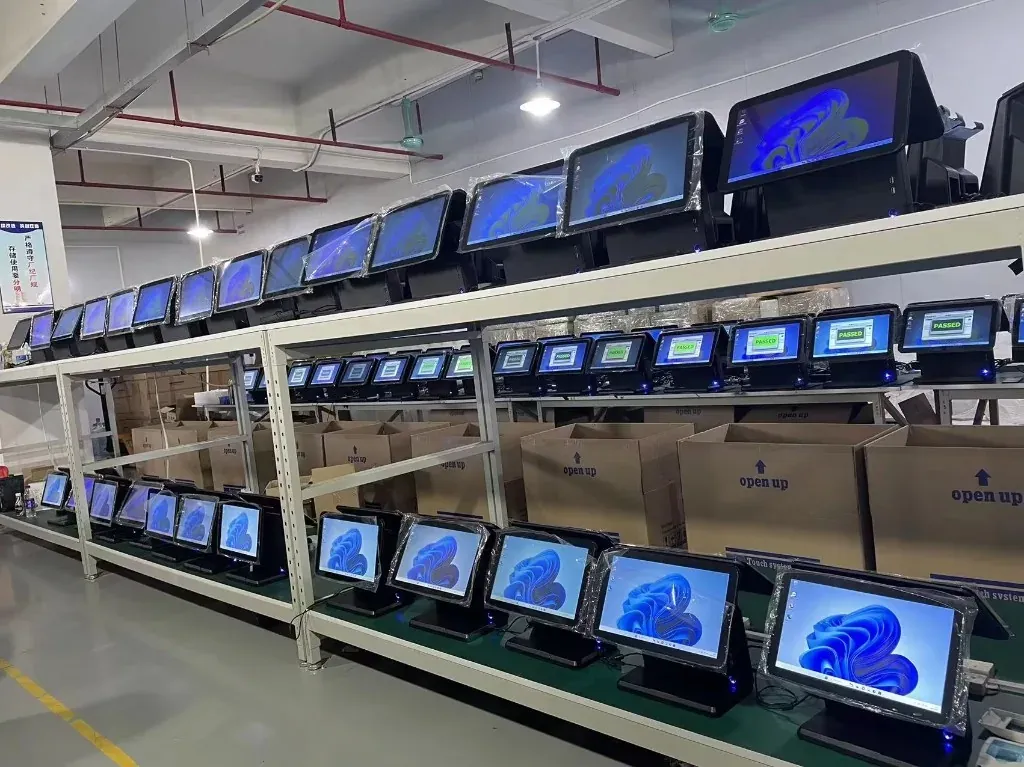 Desktop POS terminals on burn-in racks during quality testing
